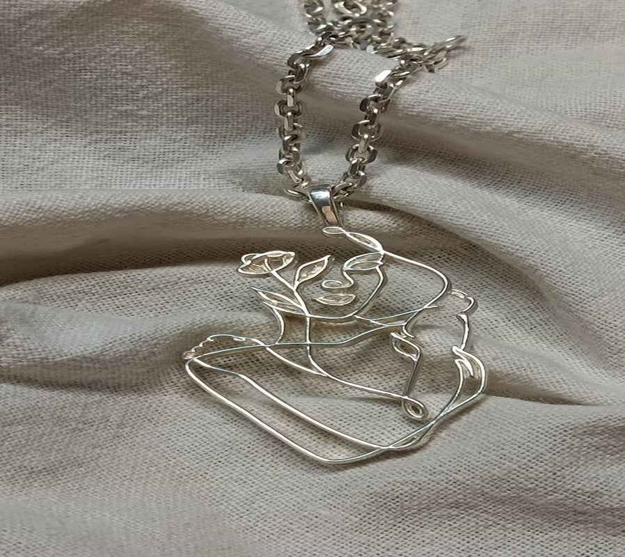 THE EMBRACING PENDENT in 92.5 Hallmarked Sterling Silver, featuring elegant floral design on a delicate chain.