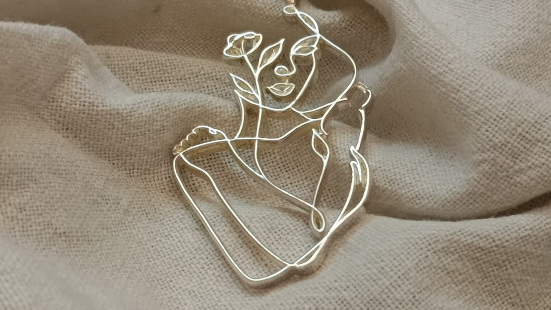 THE EMBRACING PENDENT in 92.5 Hallmarked Sterling Silver, featuring elegant floral design on a delicate chain.